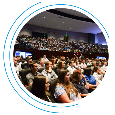 Diverse crowd enjoying a conference presentation